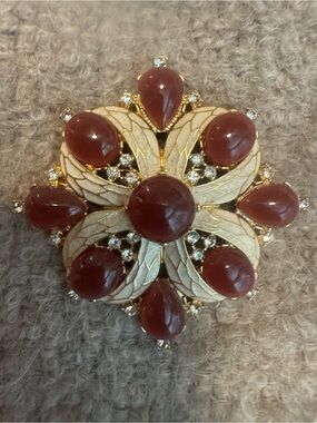 Elegant Gold-Tone Floral Brooch with Deep Brown Cabochons